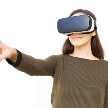 positive-satisfied-woman-vr-headset-pointing-finger-away (1)